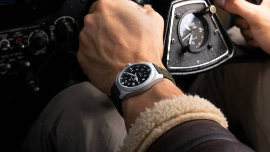 Formex AirField Jet Black 40mm worn on the wrist beside an aviation instrument