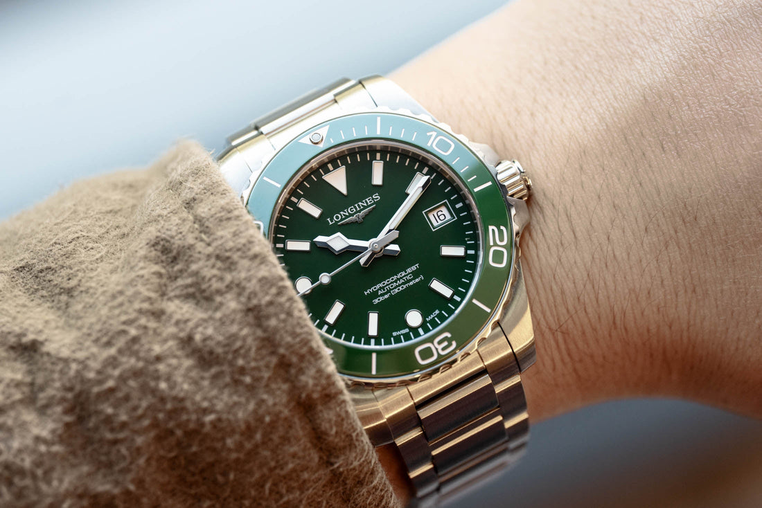 2026 Longines HydroConquest with green dial and green ceramic bezel on an H-link steel bracelet, photographed on the wrist