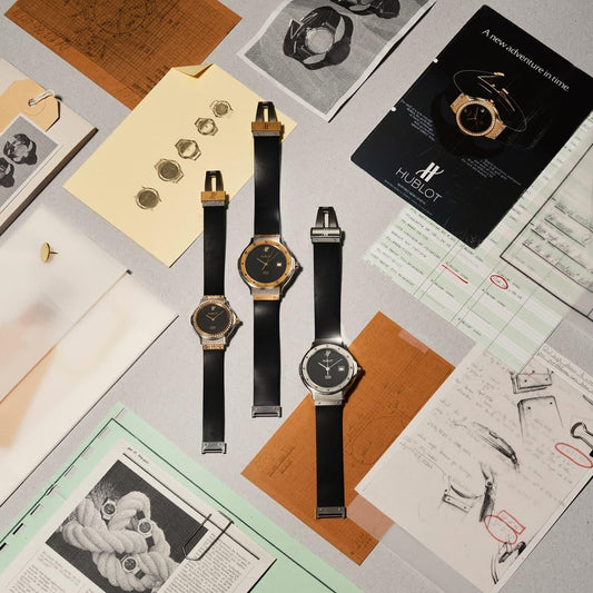 Hublot Classic Fusion Tributo yellow- and white-gold watches among design documents. Image: Hublot.