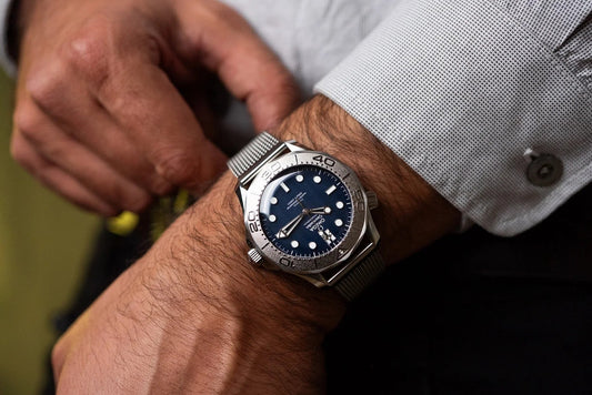 The blue James Bond edition on the wrist. Photography: via TIME+TIDE.