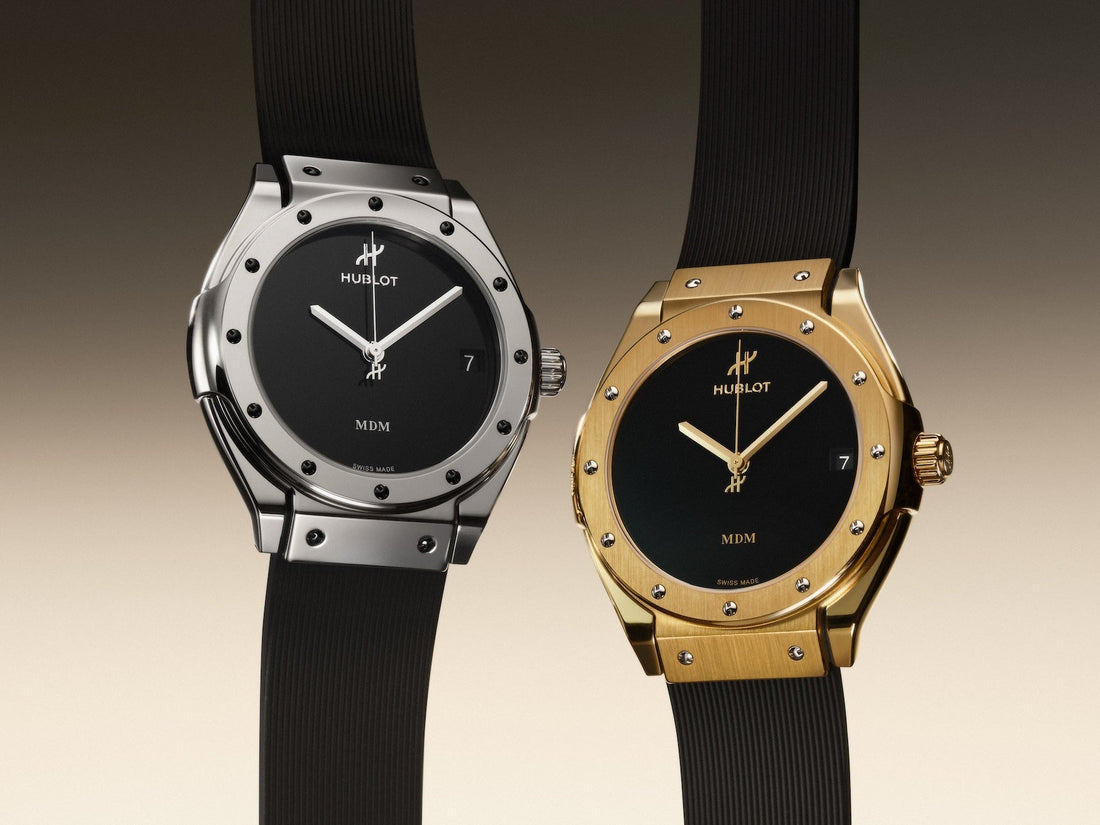 Hublot Classic Fusion Tributo watches in white gold and yellow gold with black dials and rubber straps.